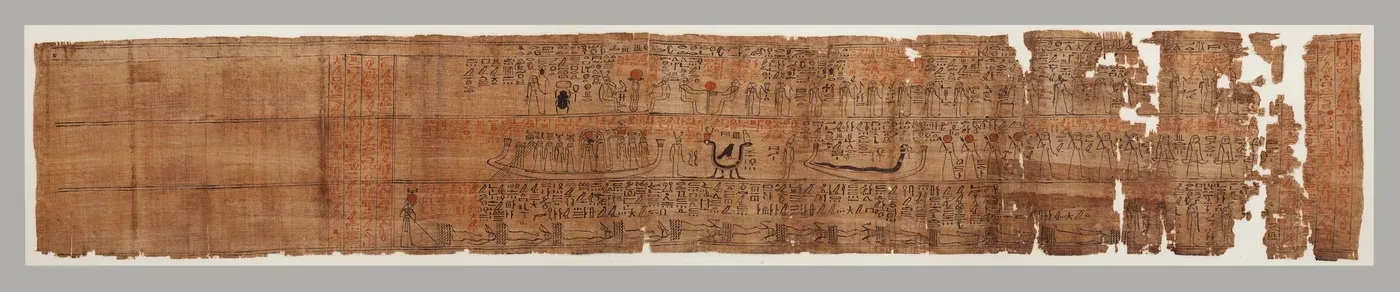 A long, narrow strip of brown papyrus. The left end is blank apart from ruled lines. The rest is drawn in black and red ink in three bands: a boat with standing figures, a hawk on a serpent and a second boat with a long snake in the middle; a beetle and seated figures above; rows of hieroglyphs and floating bodies below. The right end is torn.