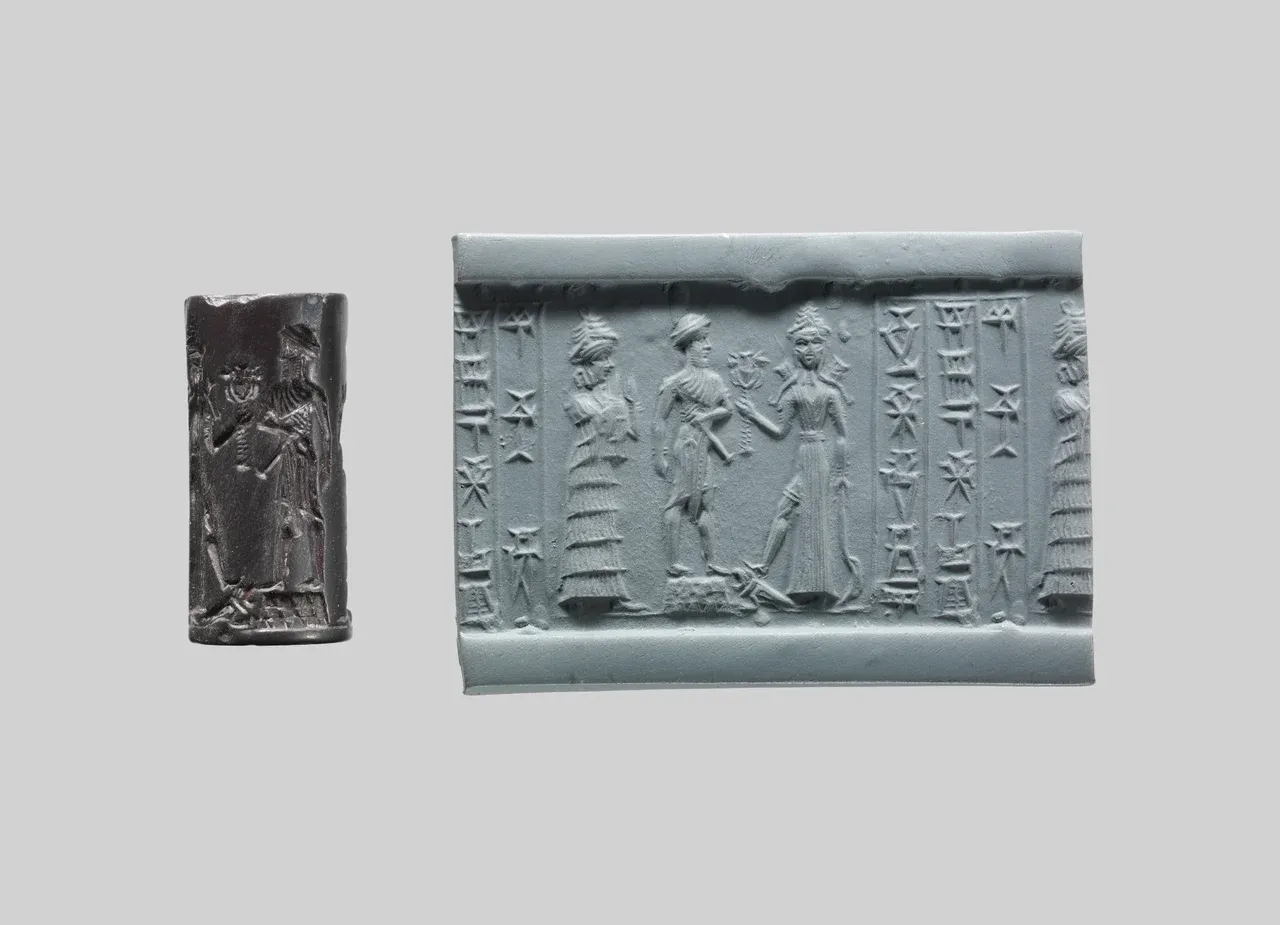 A dark cylinder seal beside its modern impression, showing Ishtar with weapons, two other figures, and columns of cuneiform.